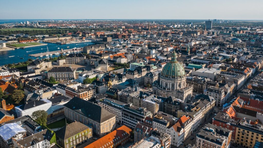 Aerial view of Copenhagen with the green dome of Frederik’s Church and surrounding historic buildings