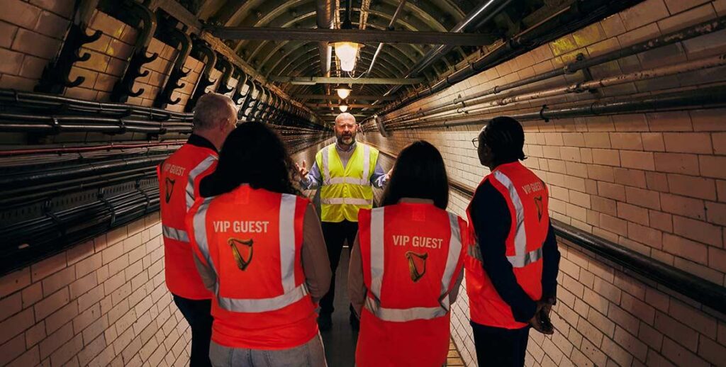 Visitors exploring an underground tunnel during the Guinness Brewery Experience in Dublin