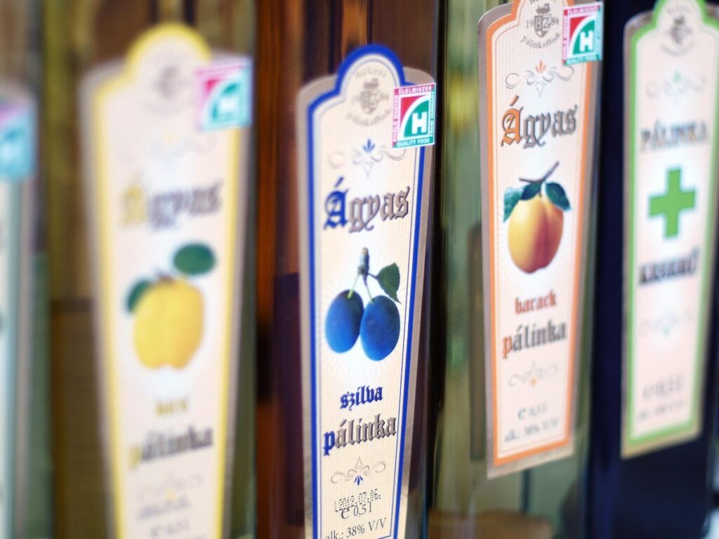 Bottles of traditional Hungarian fruit pálinka including plum and apricot varieties