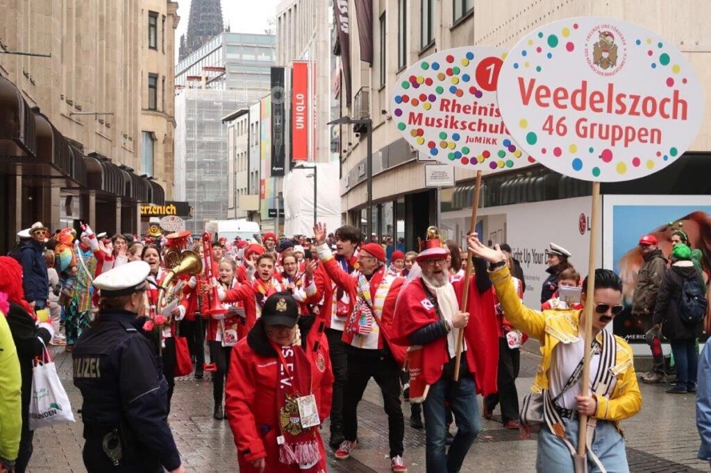 Cologne Carnival parade with costumed participants in the city centre