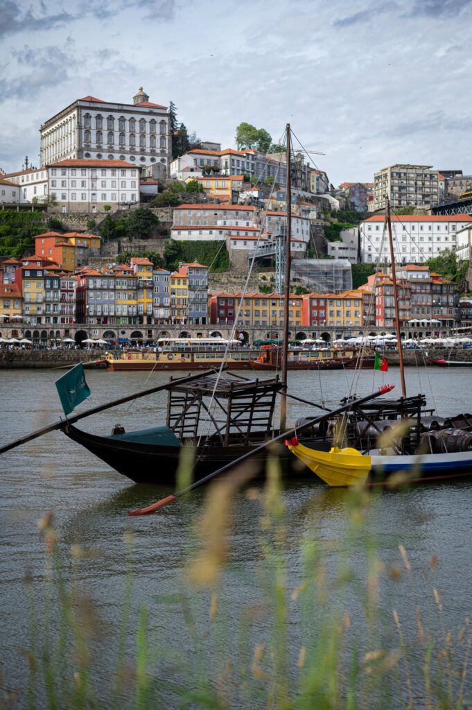 Traditional rabelo boats on the Douro River with Porto’s colourful Ribeira waterfront in the background