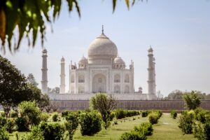 Taj Mahal seen across its gardens, with the central dome and four minarets visible