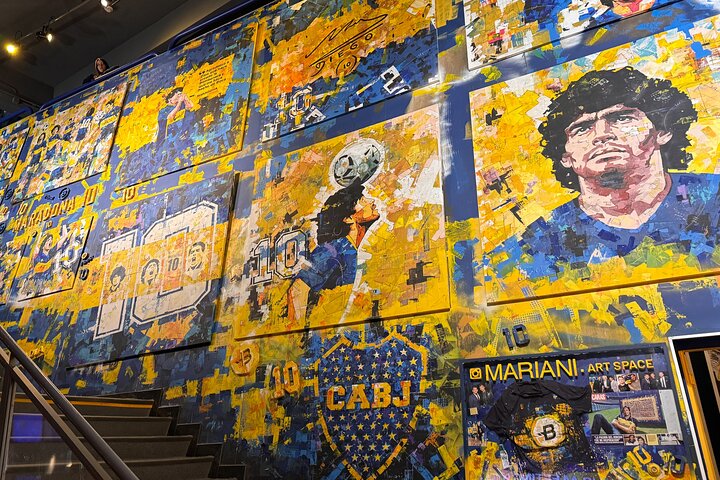 Blue and yellow Boca Juniors mural featuring Diego Maradona inside the club museum