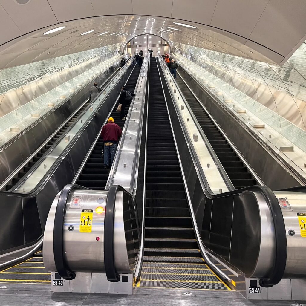 Long escalators descending to the platforms at Grand Central Madison